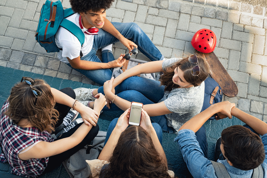 Young people sitting and talking.